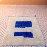White Moroccan rug with abstract Klein blue patterns