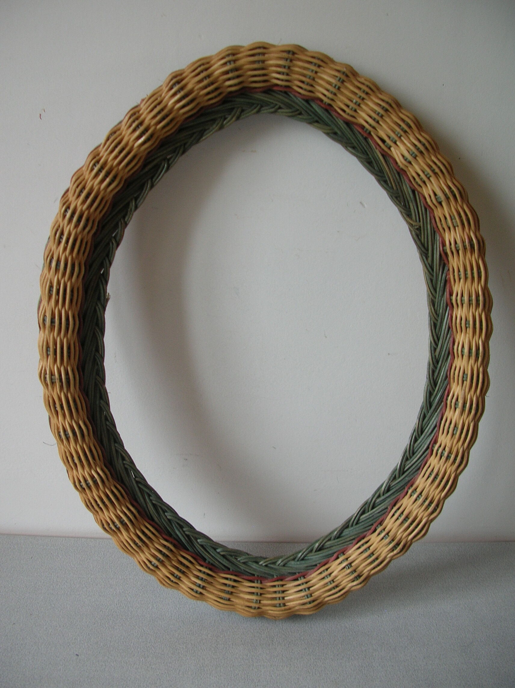 Old oval frame in rattan and wood photo door mirror frame