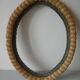 Old oval frame in rattan and wood photo door mirror frame