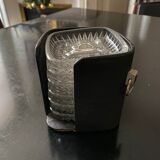6 individual ashtrays in a leather case