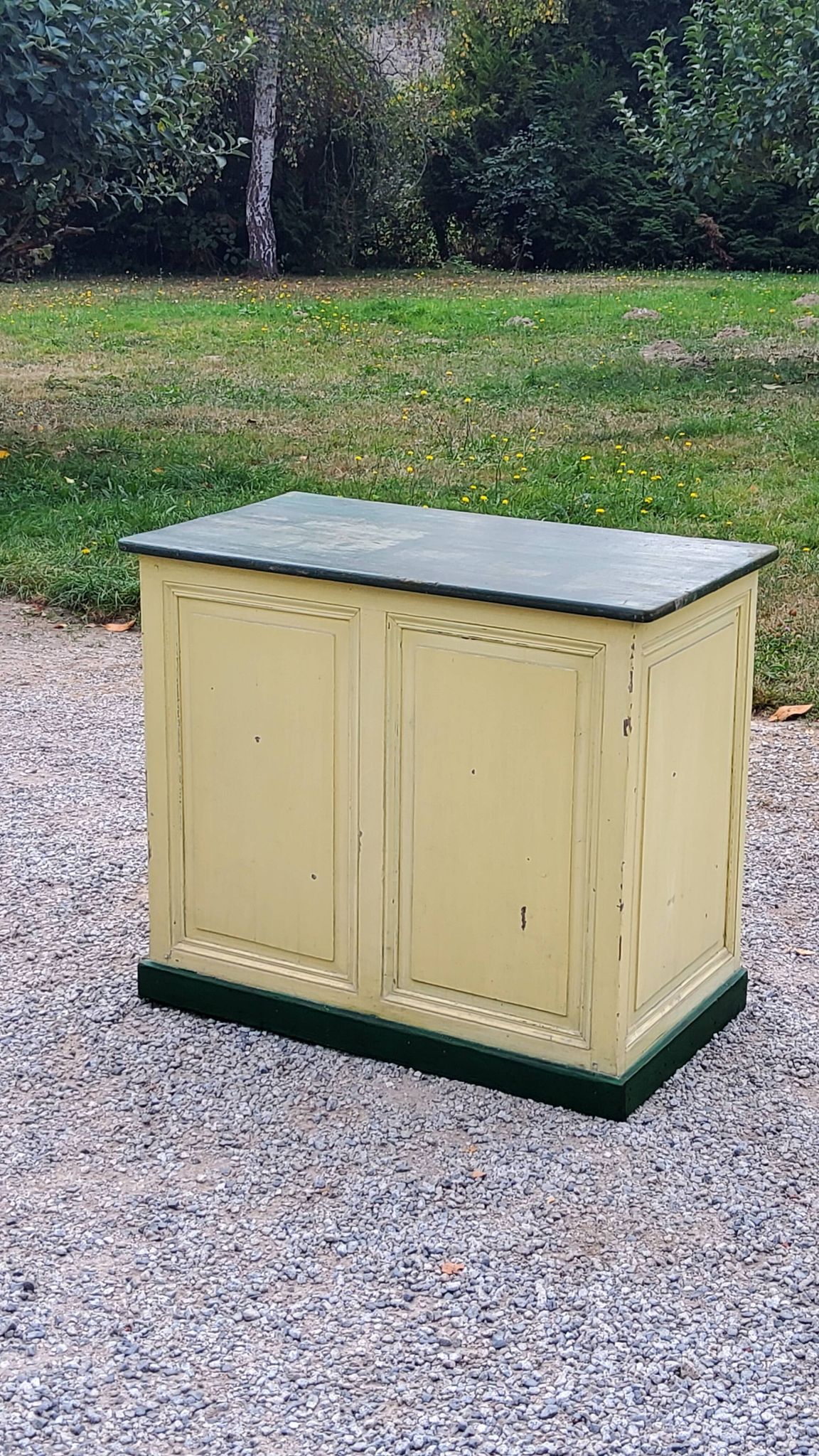Late 19th century grocery counter in green and yellow patina painted wood