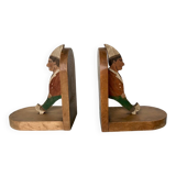 Old wooden bookends with painted characters