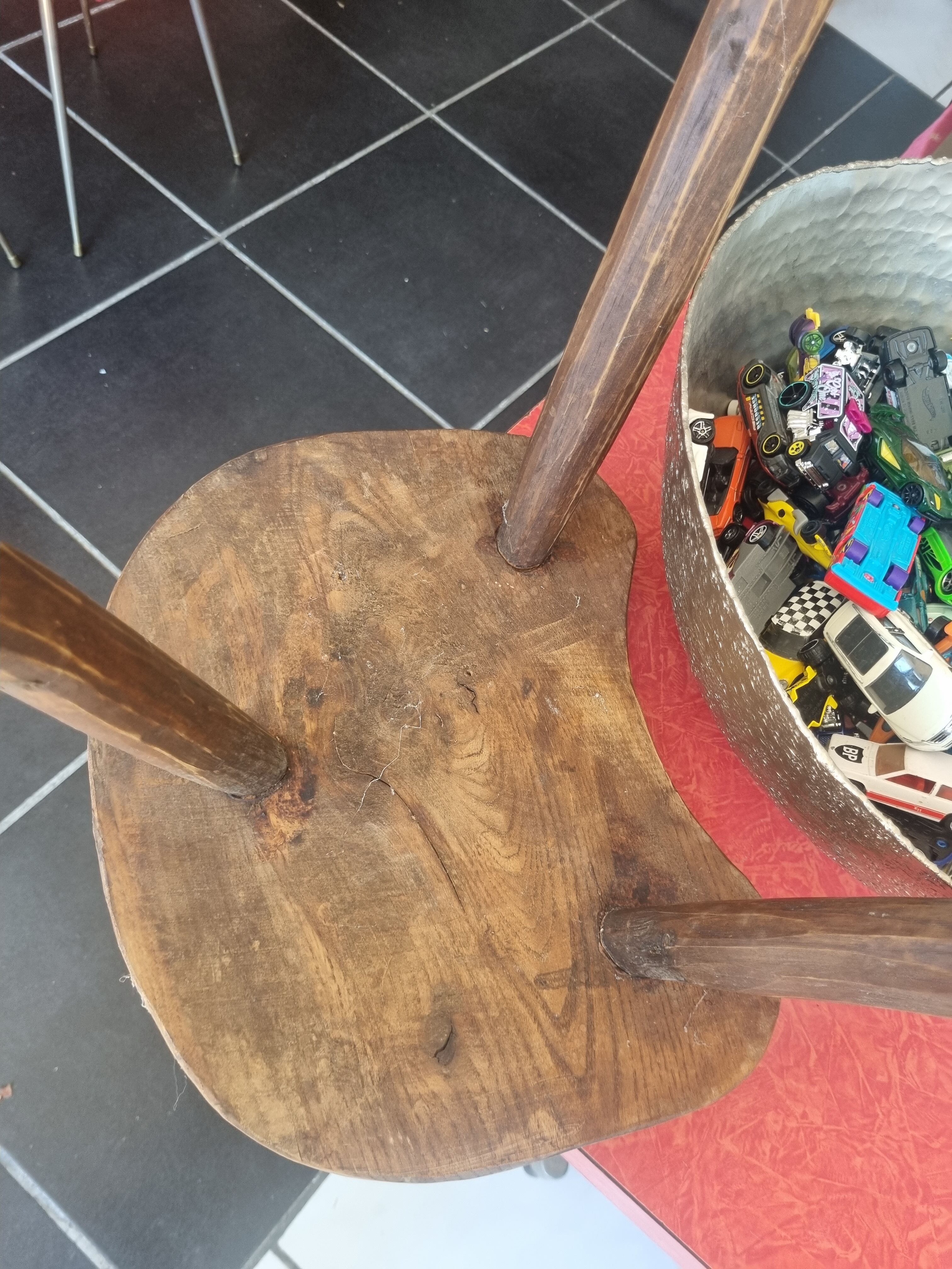 Old wooden tripod stool