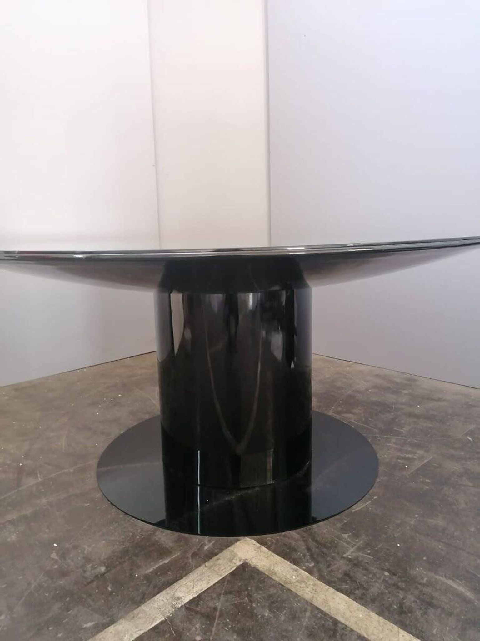 Black lacquered glass table and glass in the hoof style, Italy.