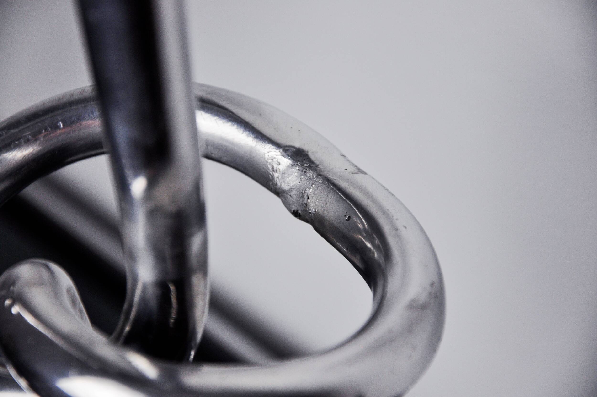 Pair of XL knotted candlesticks in aluminum, Italy, 1980