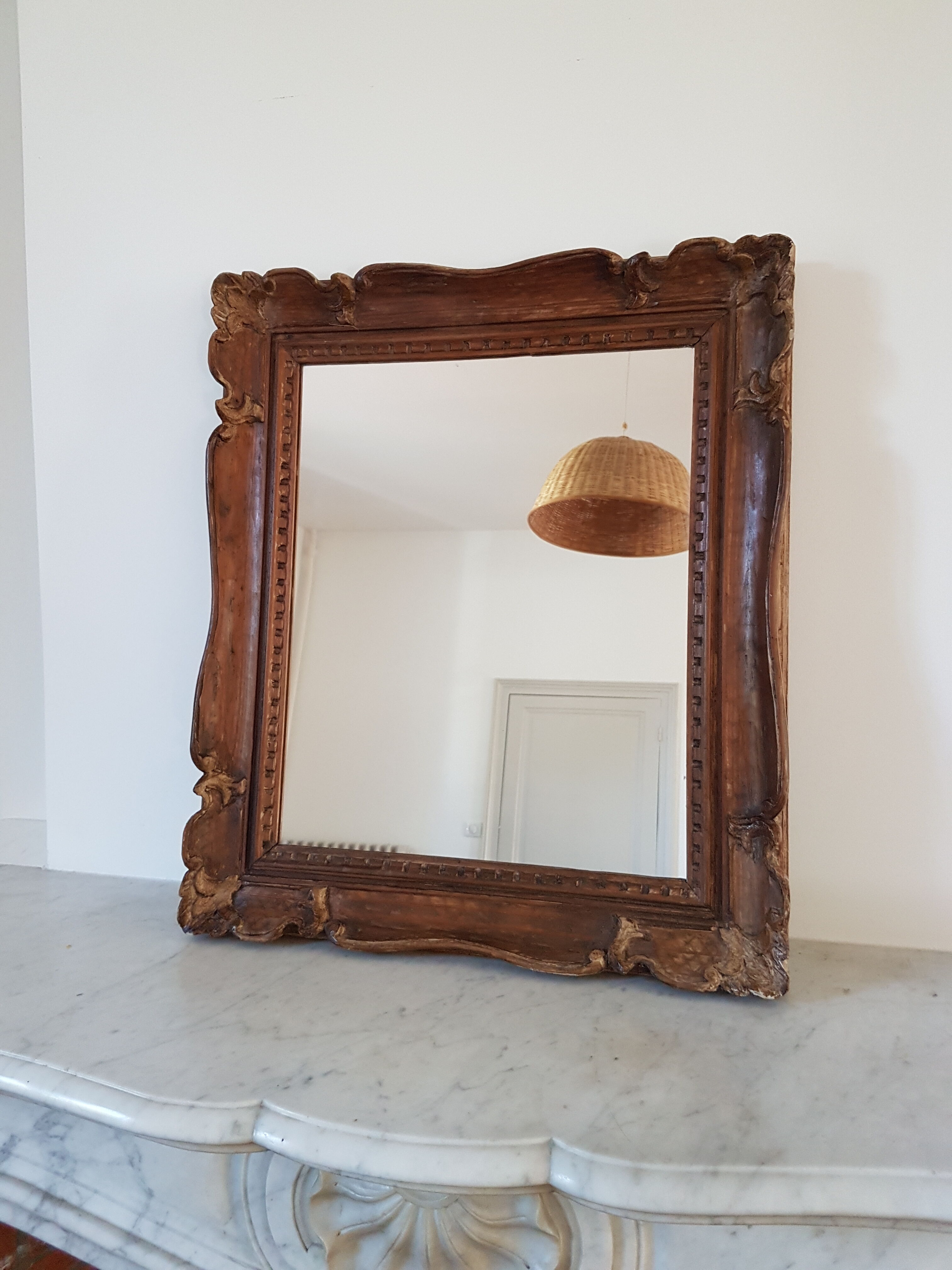 Carved wooden mirror