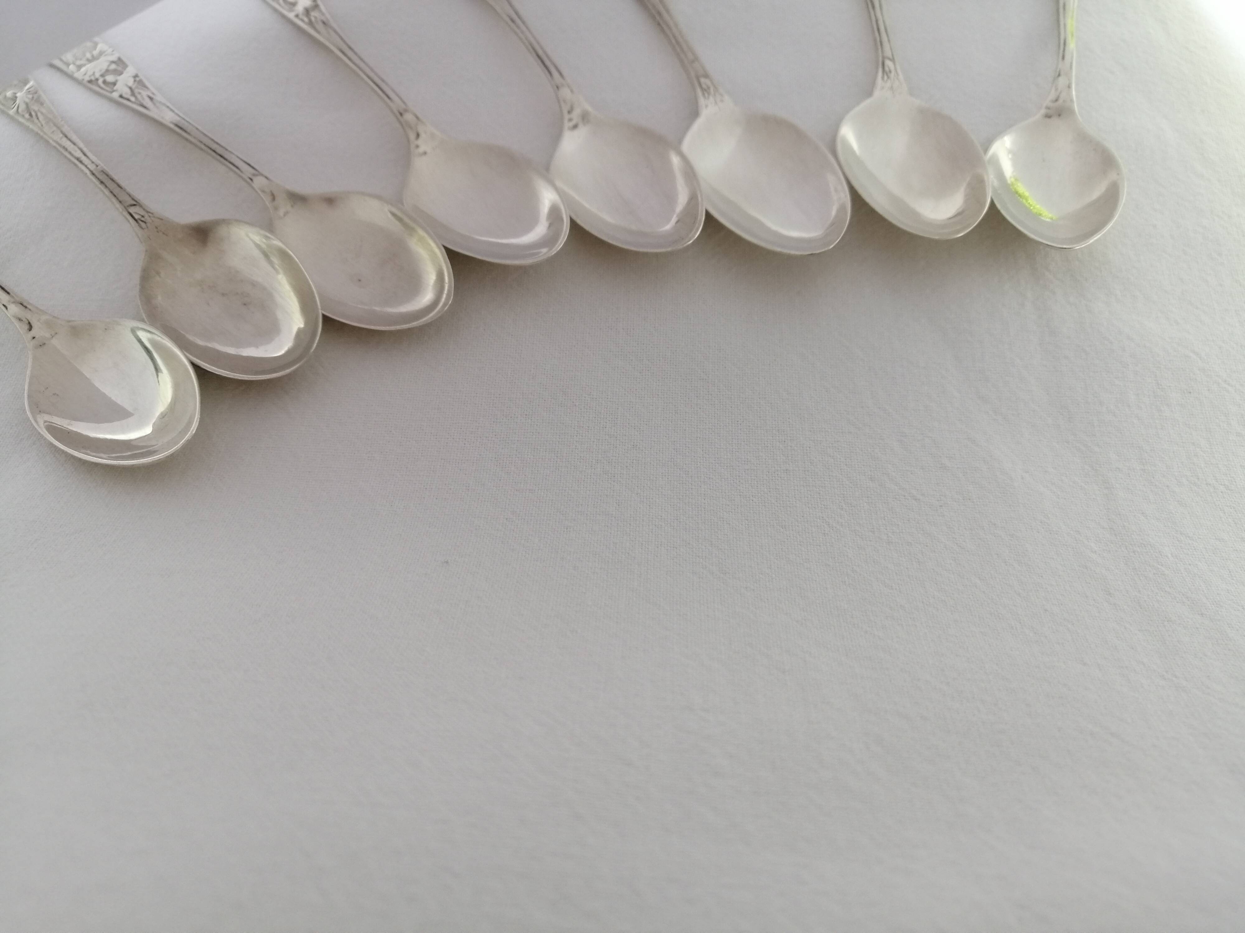 8 small silver spoons