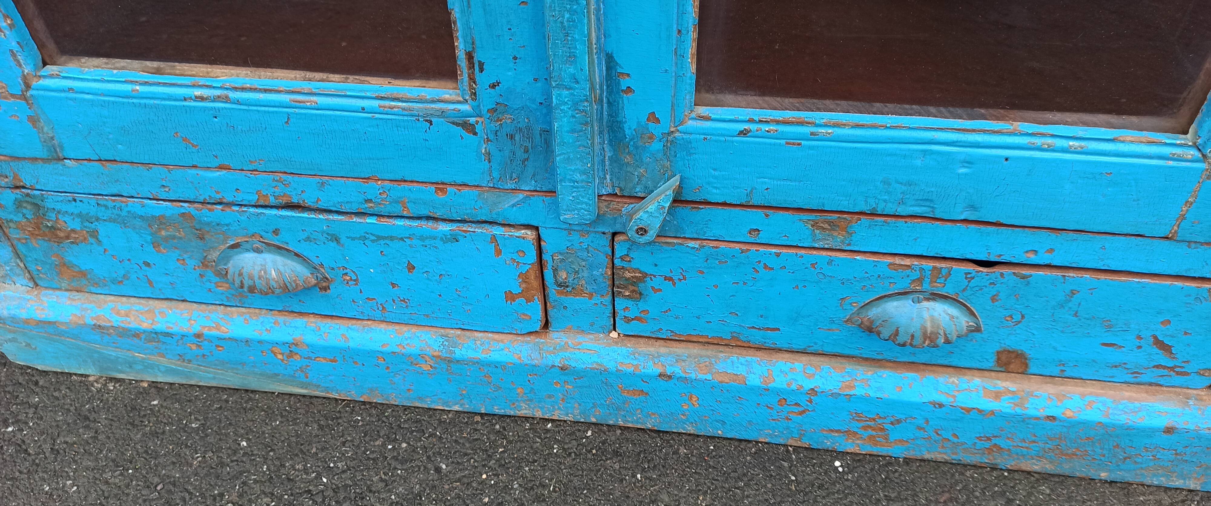 Old wooden glazed cabinet with two doors and two drawers