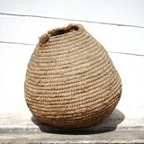Old basket, burgundy straw and bramble, woven basket, interior decoration, pantry, flowerpot