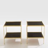 Pair of neoclassical side tables in brass and black leather by Maison Jansen, 1960.