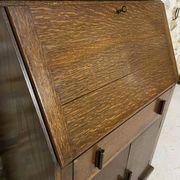Oak display secretary cabinet with drop-down front, two sections.
