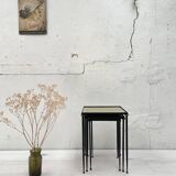 Suite of metal and glass nesting tables.