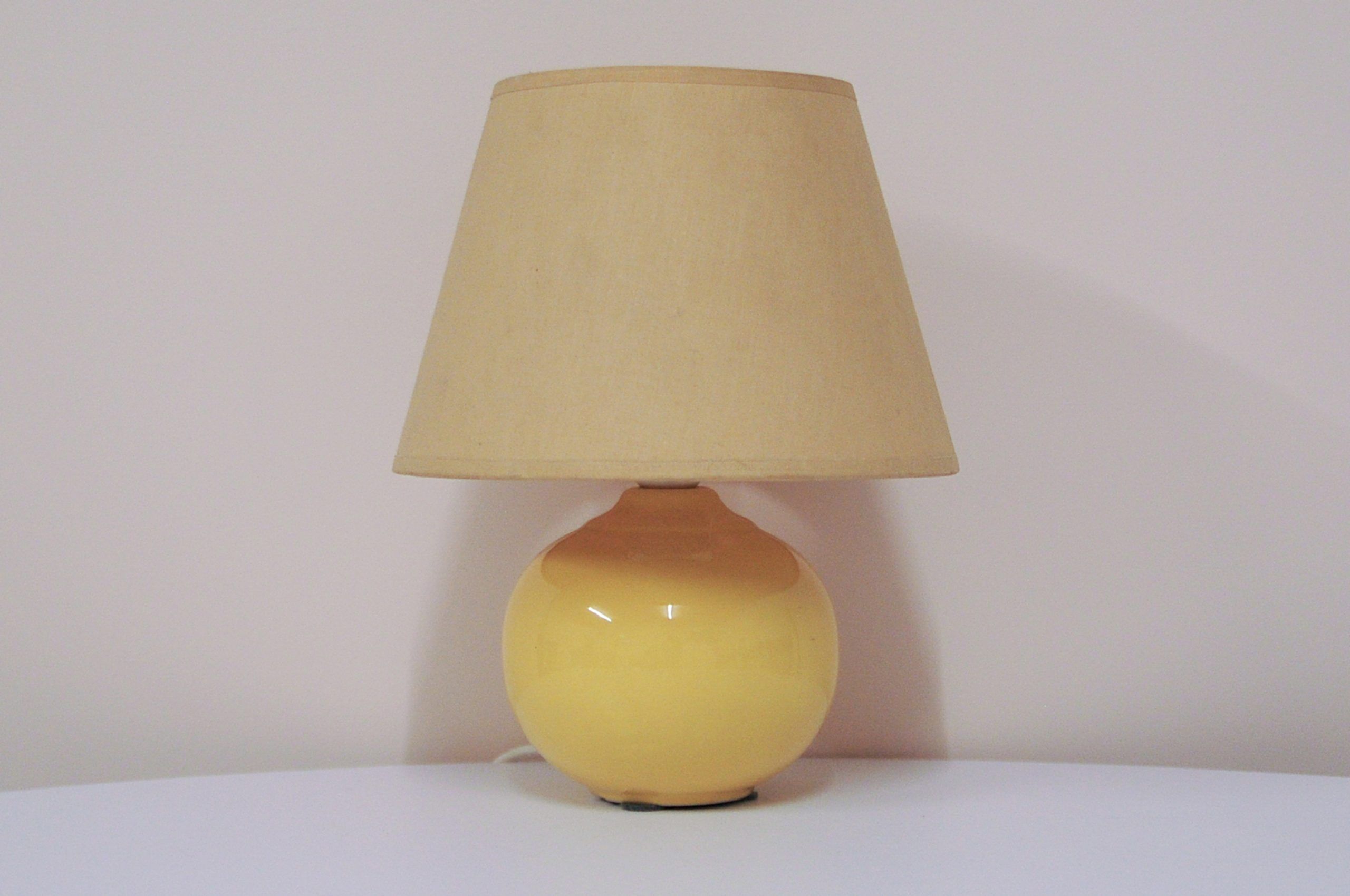Light yellow vintage table lamp with beige lampshade from Denmark