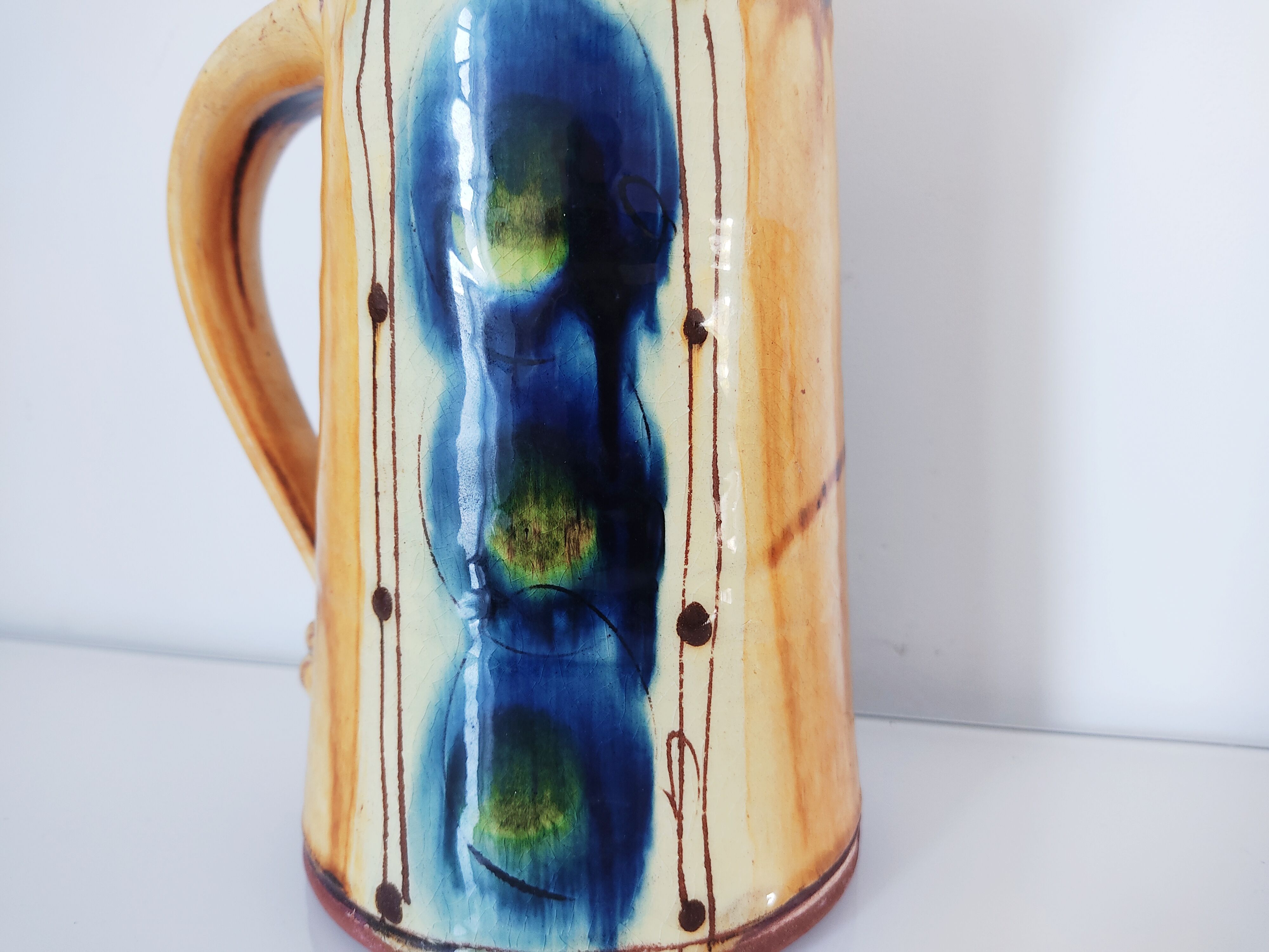 Cruche terre cuite émaux jaune et bleu