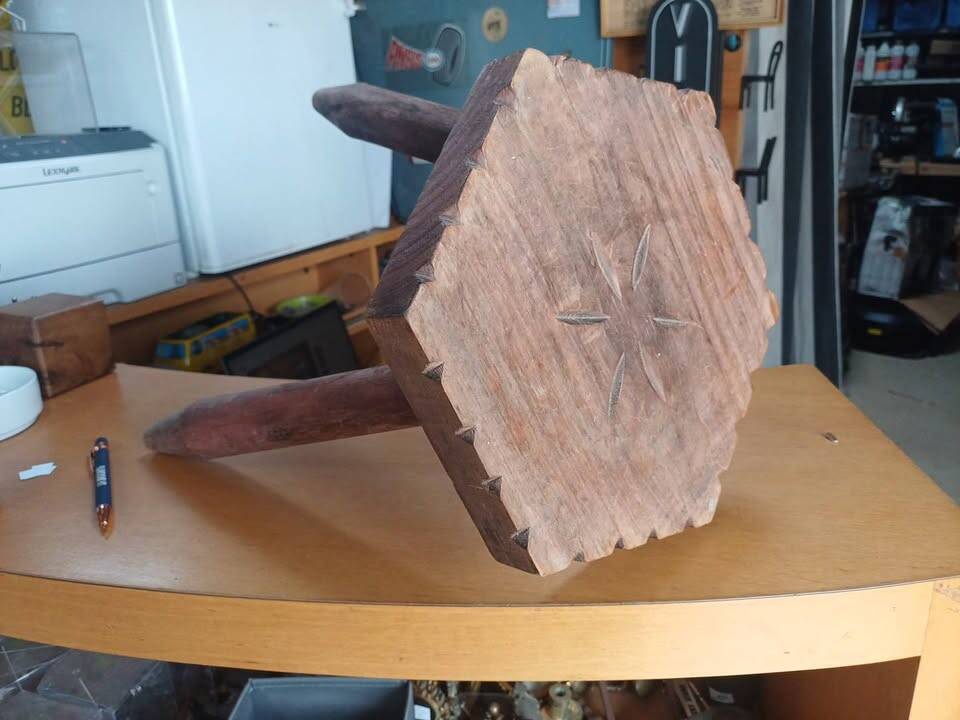 Vintage tripod stool in carved solid wood.