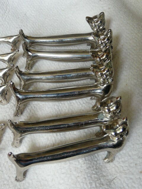 12 silver metal knife holders 6 dogs and 6 cats