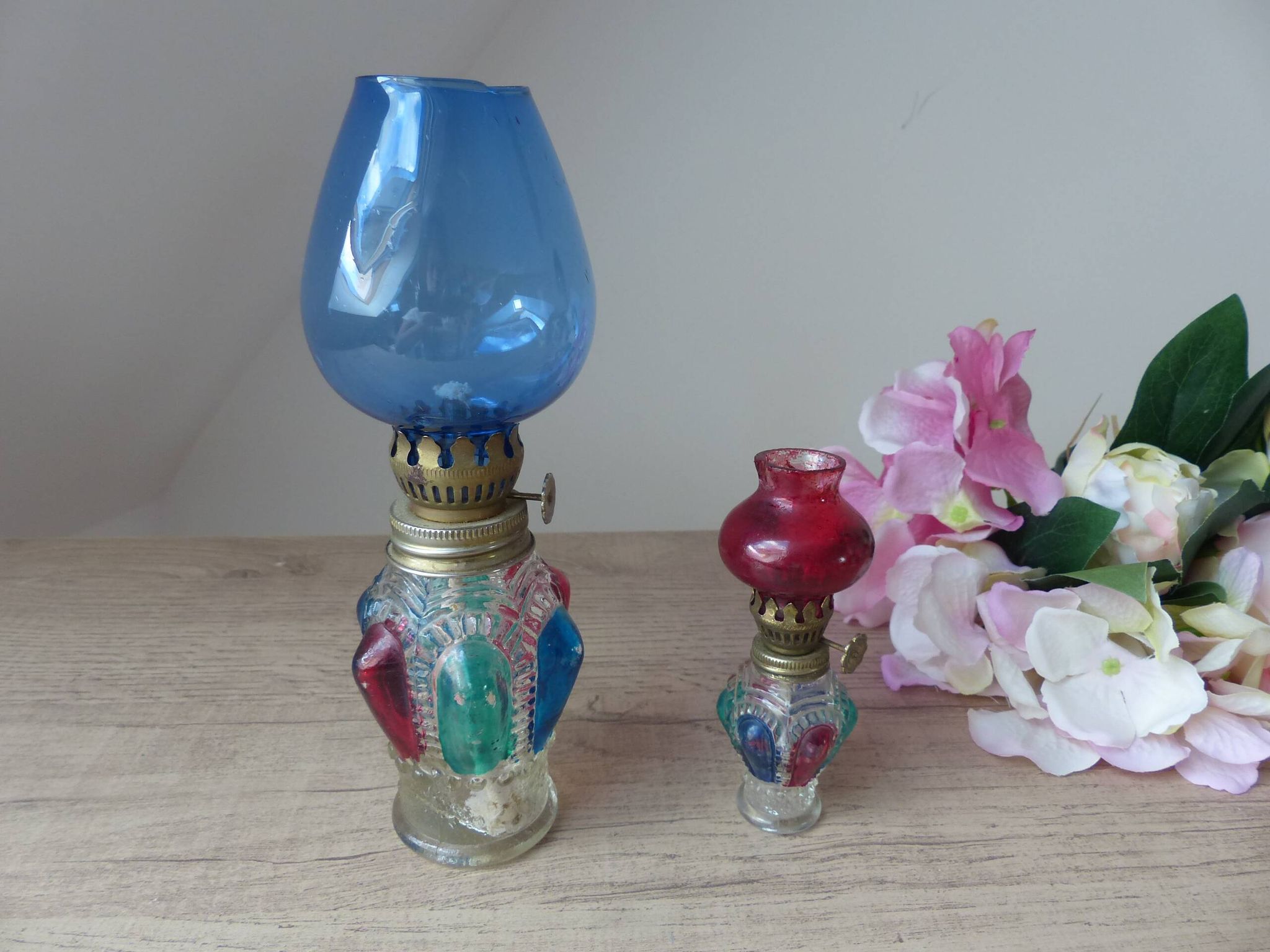 Set of two old coloured glass oil lamps Hong Kong.