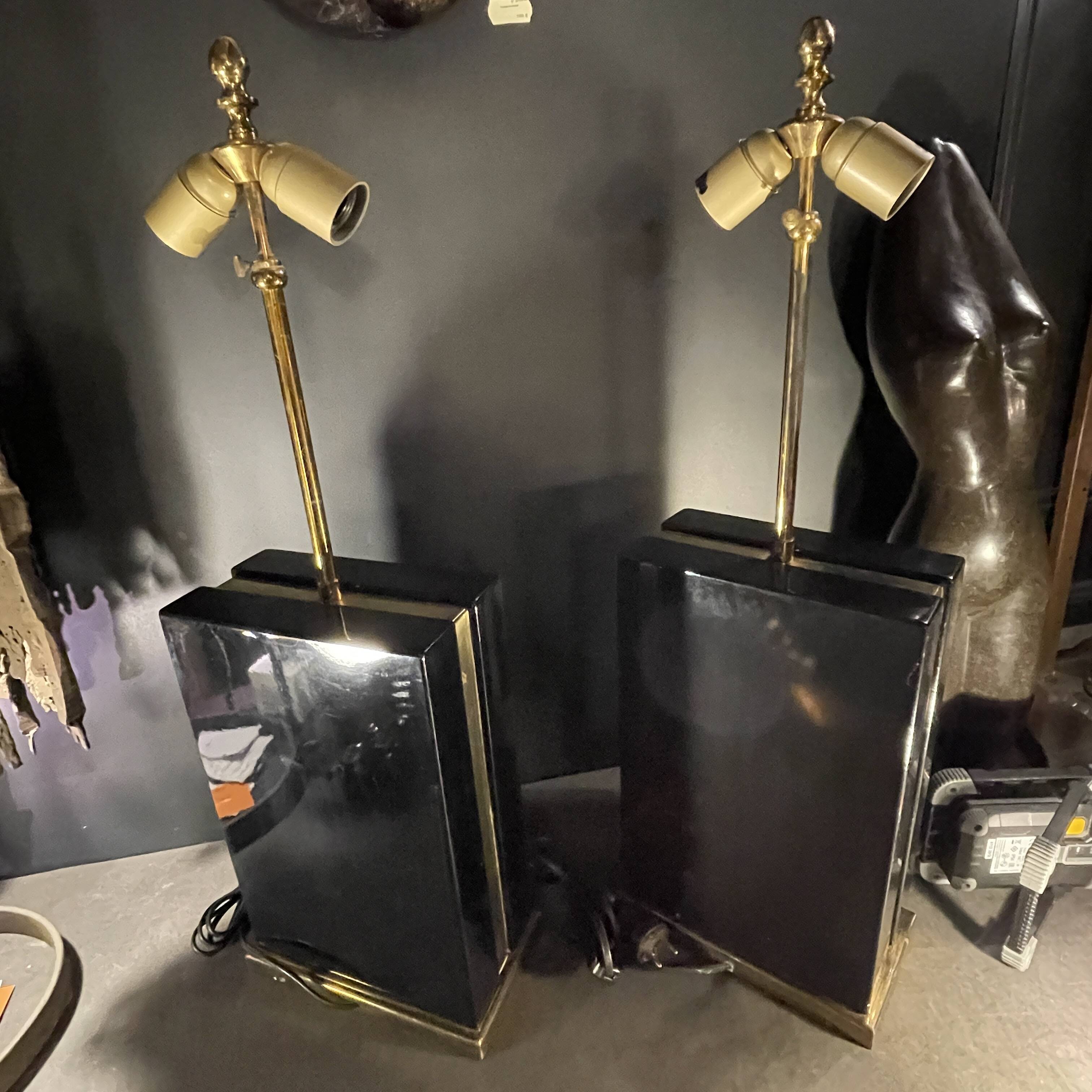 Pair of black lacquered and brass table lamps, circa 1970