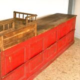 Former red patina and oak tray trading counter