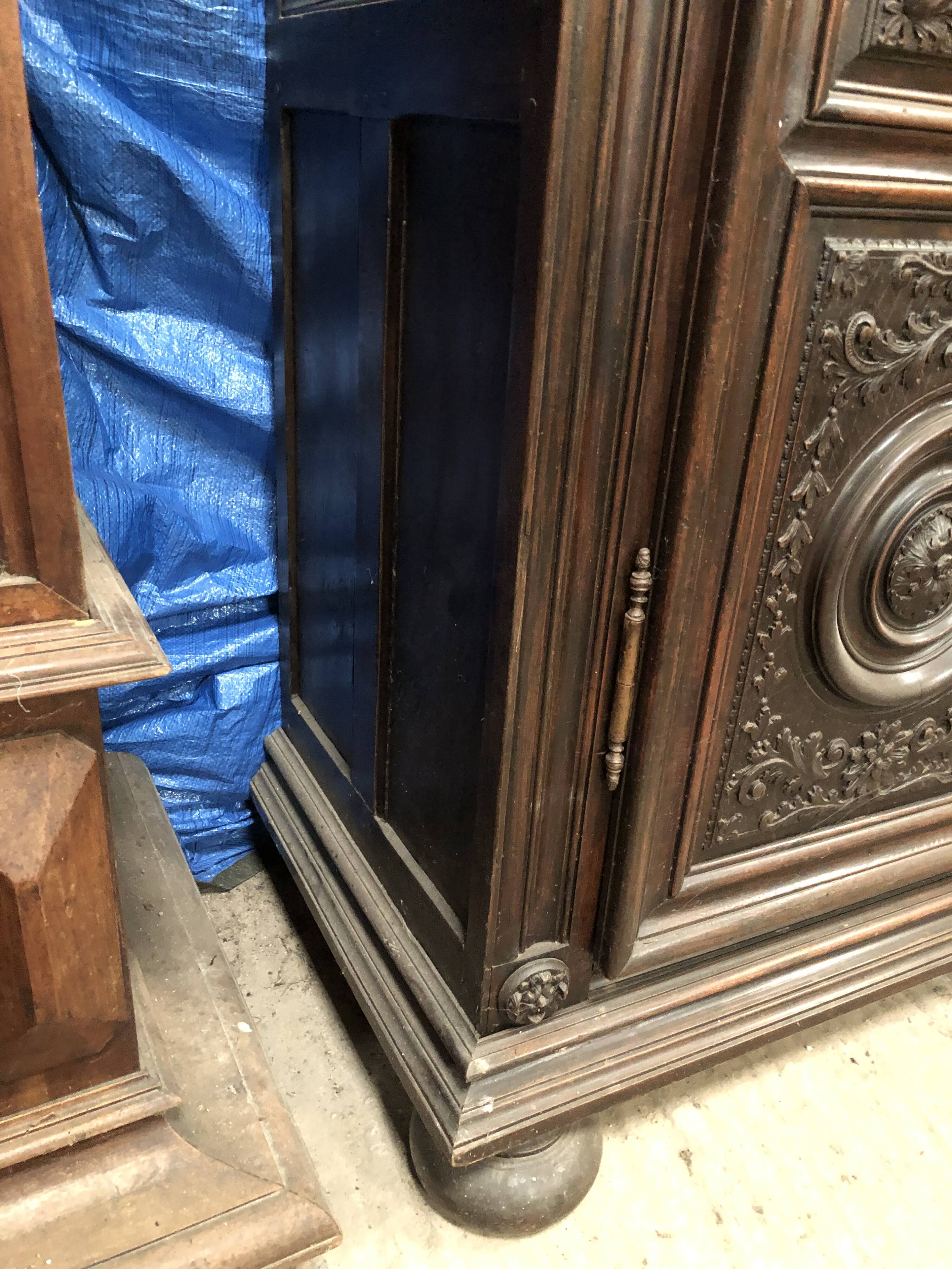 Antique Louis XIII armoire in solid walnut with carved doors
