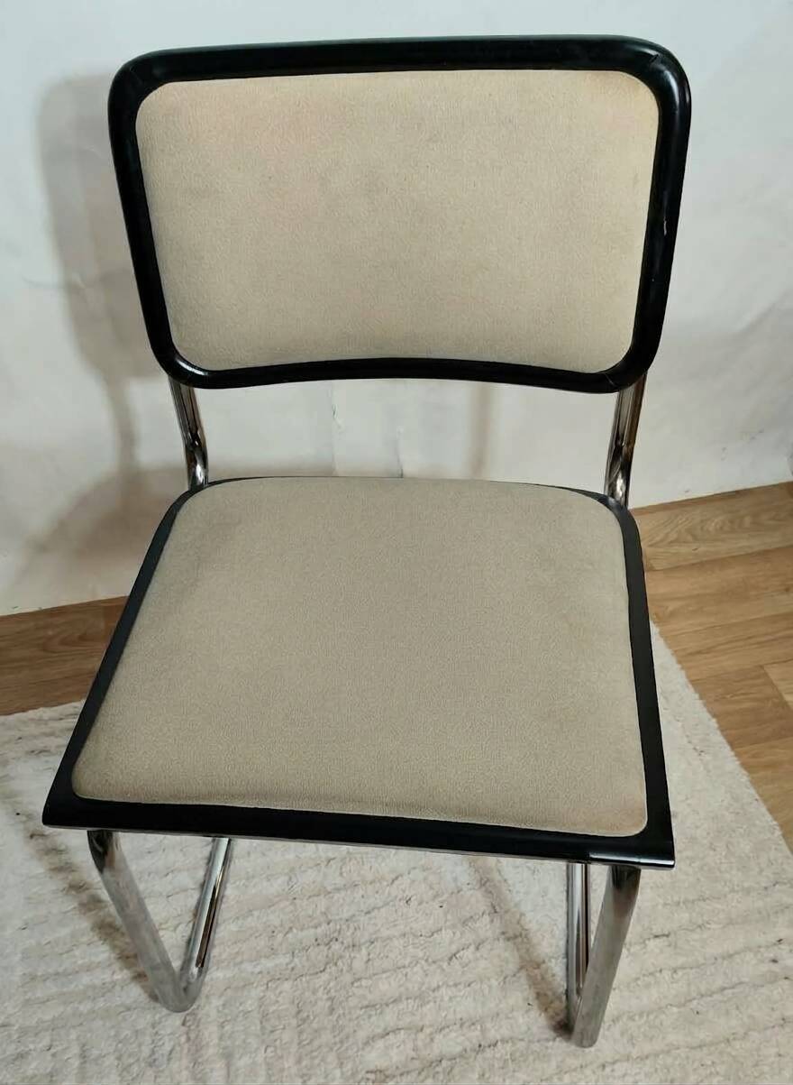 Cesca B32 chair by Marcel Breuer, upholstered in beige fabric.