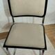 Cesca B32 chair by Marcel Breuer, upholstered in beige fabric.