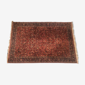 Tapis en laine à décor floral sur fond rouge brique 276 x 183 cm
