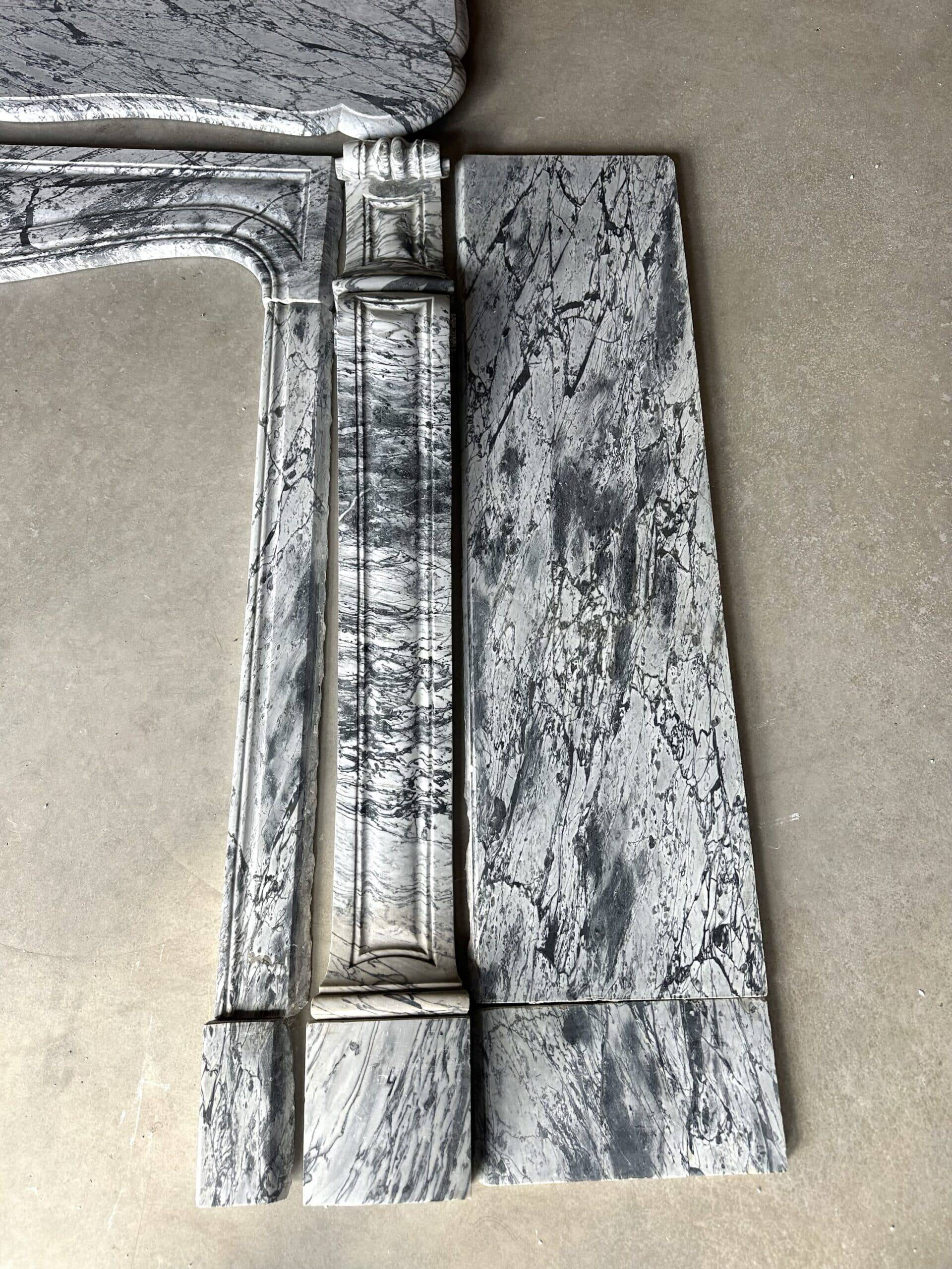 Pompadour fireplace in Louis XV style from around 1880 in blue floral marble.