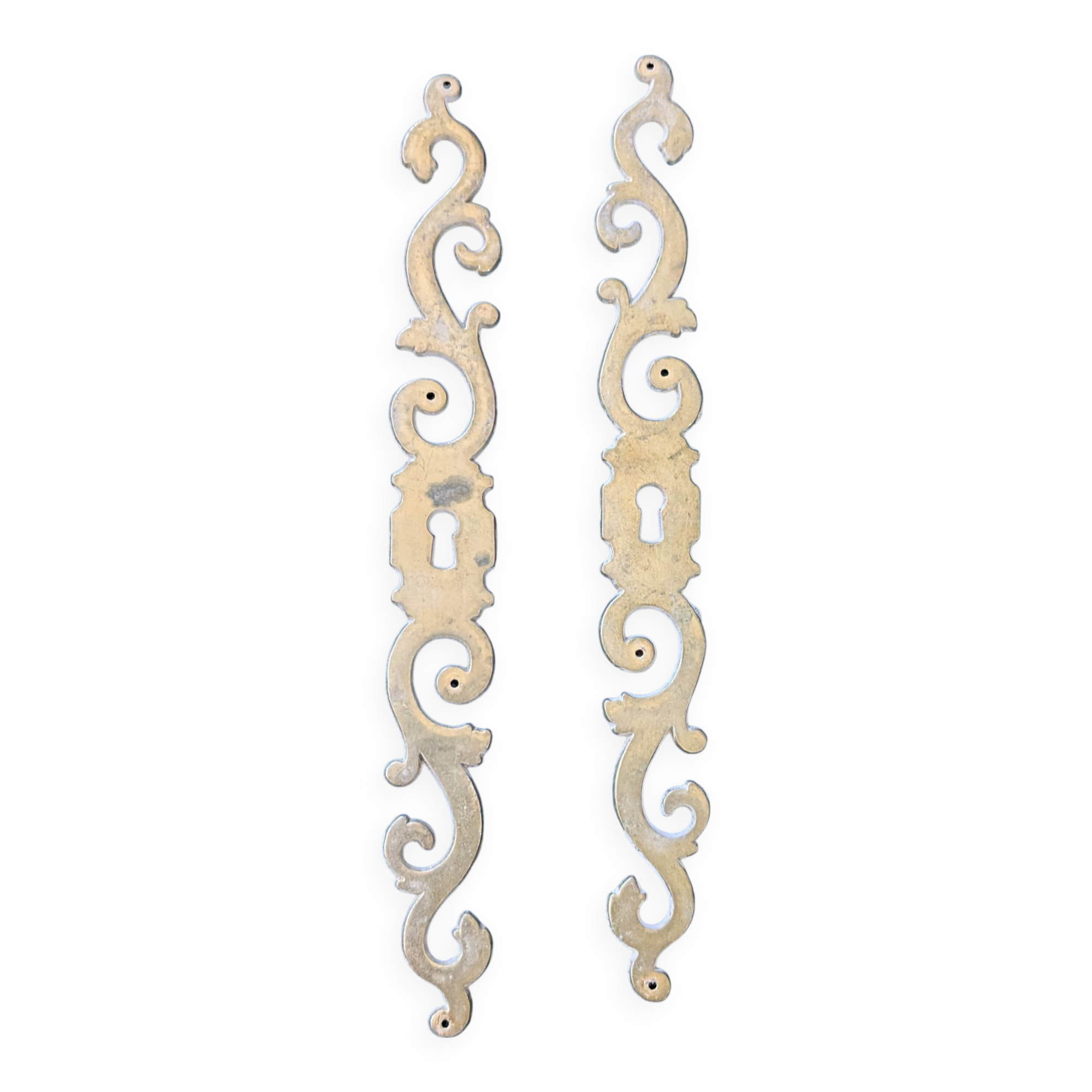 Pair of brass keyholes