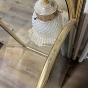 Vintage triptych mirror in brass with wall lights.