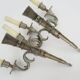 Pair of empire style double light wall lights in silvered bronze. the 50's