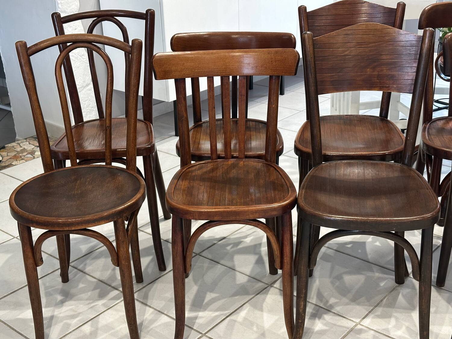 Set of 12 mismatched bistro chairs Baumann & Fischel 1930