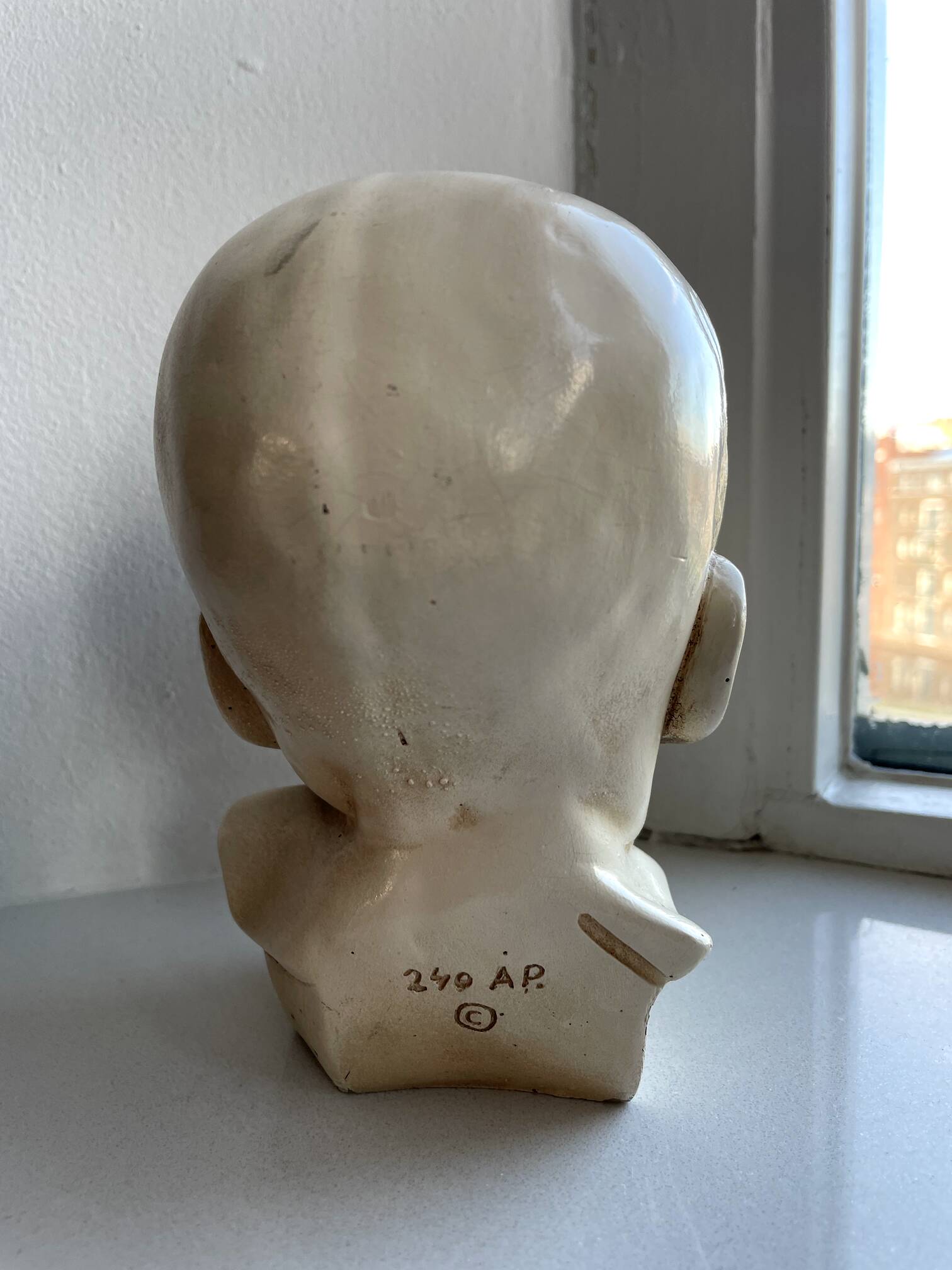 Child bust made from resin by Antoine Paridon, signed 240 A.P.