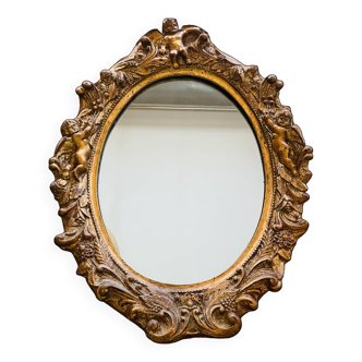 Ancien miroir en résine doré