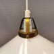 A set of hanging lamps in milky white opal glass with brass top.