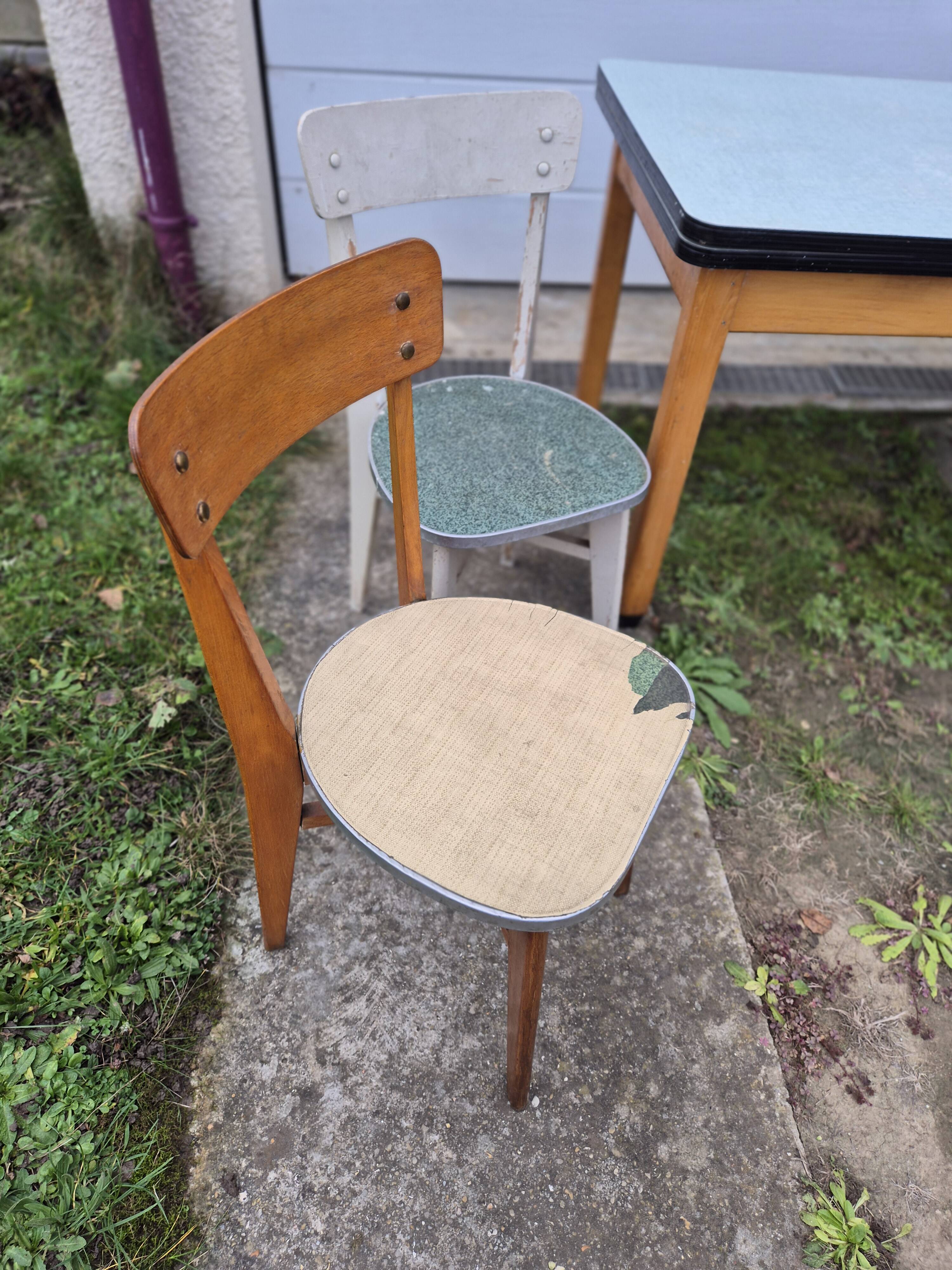 Vintage Scandinavian table and chair set with a wooden frame and formica top.