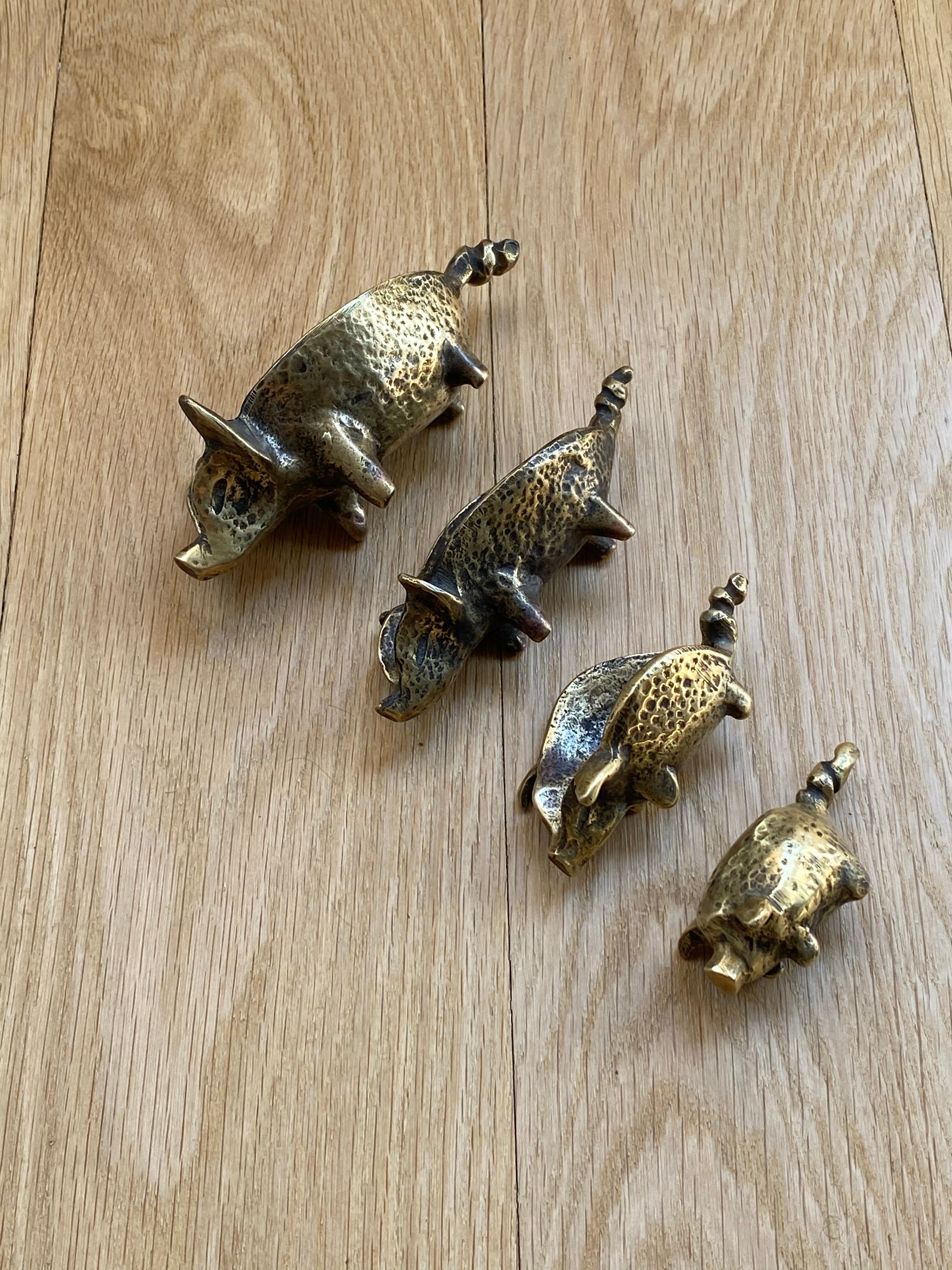 4 Pfizer bronze ashtray pigs