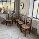 Set of 4 oak and straw chairs Dudouyt 1940