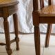 Antique armchair and stool with caned seat and fluted legs