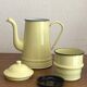 Large vintage coffee pot in pale yellow enamel.