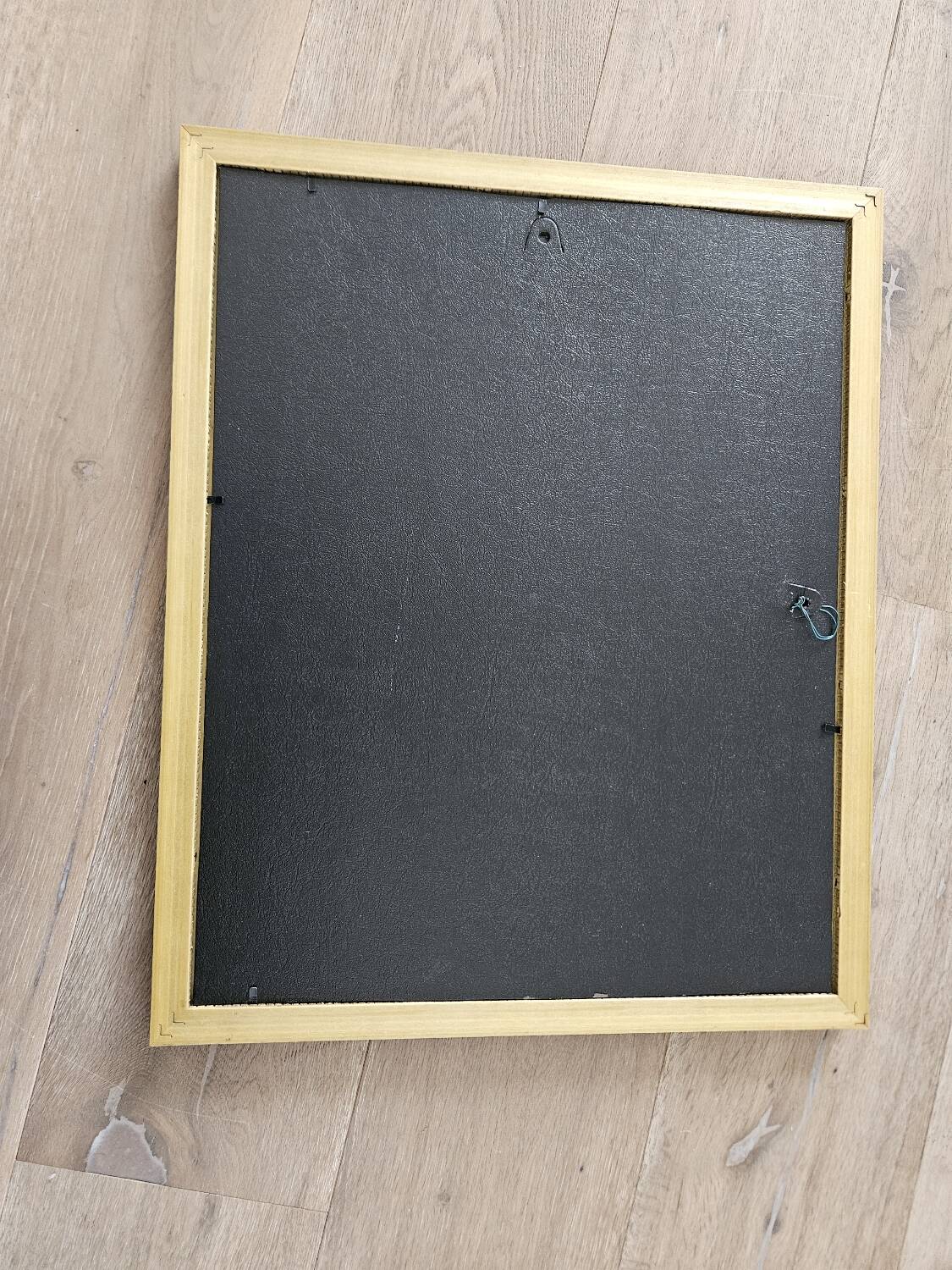 Golden frame with purple floral patterns