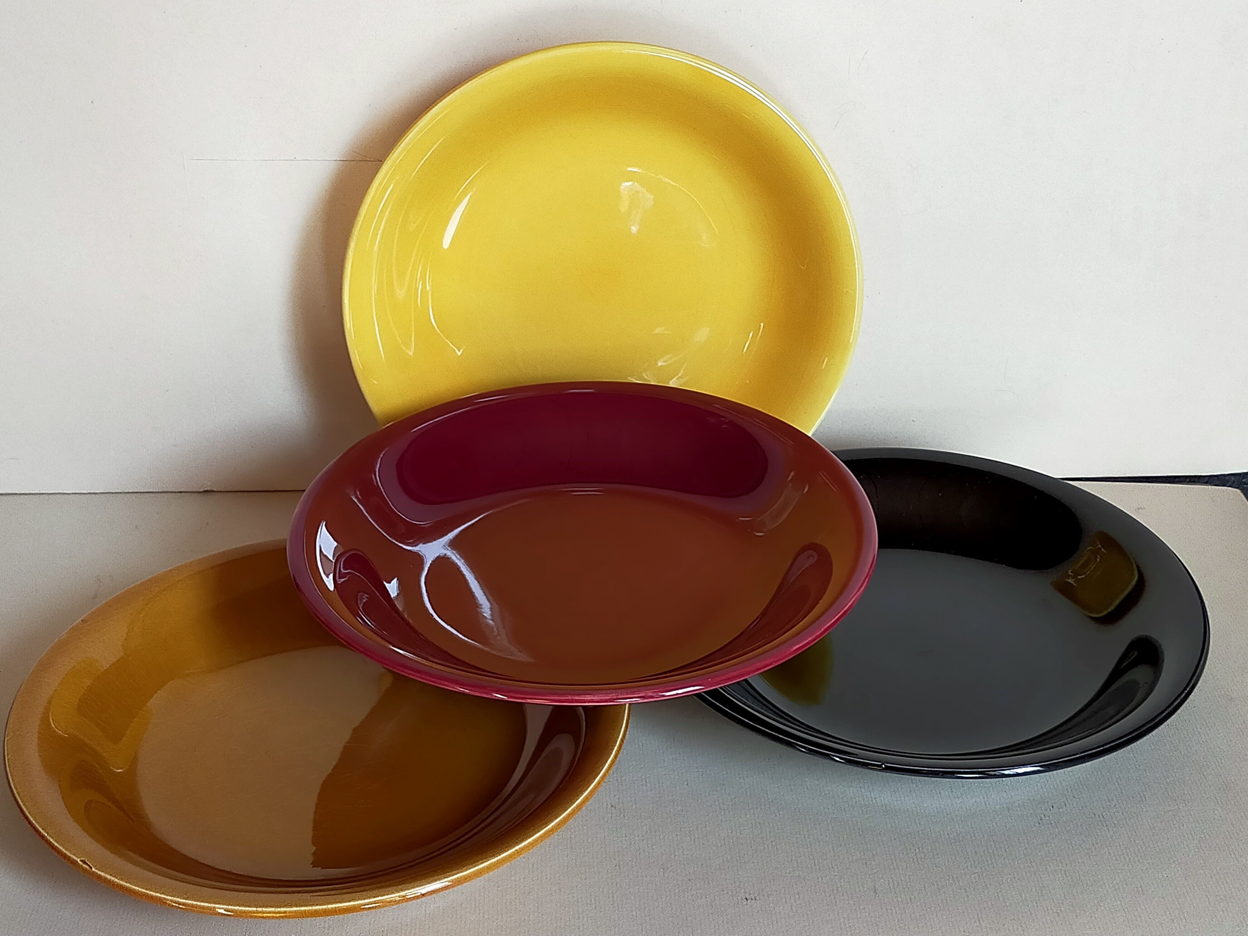 Four multicolored soup plates from the 1950s