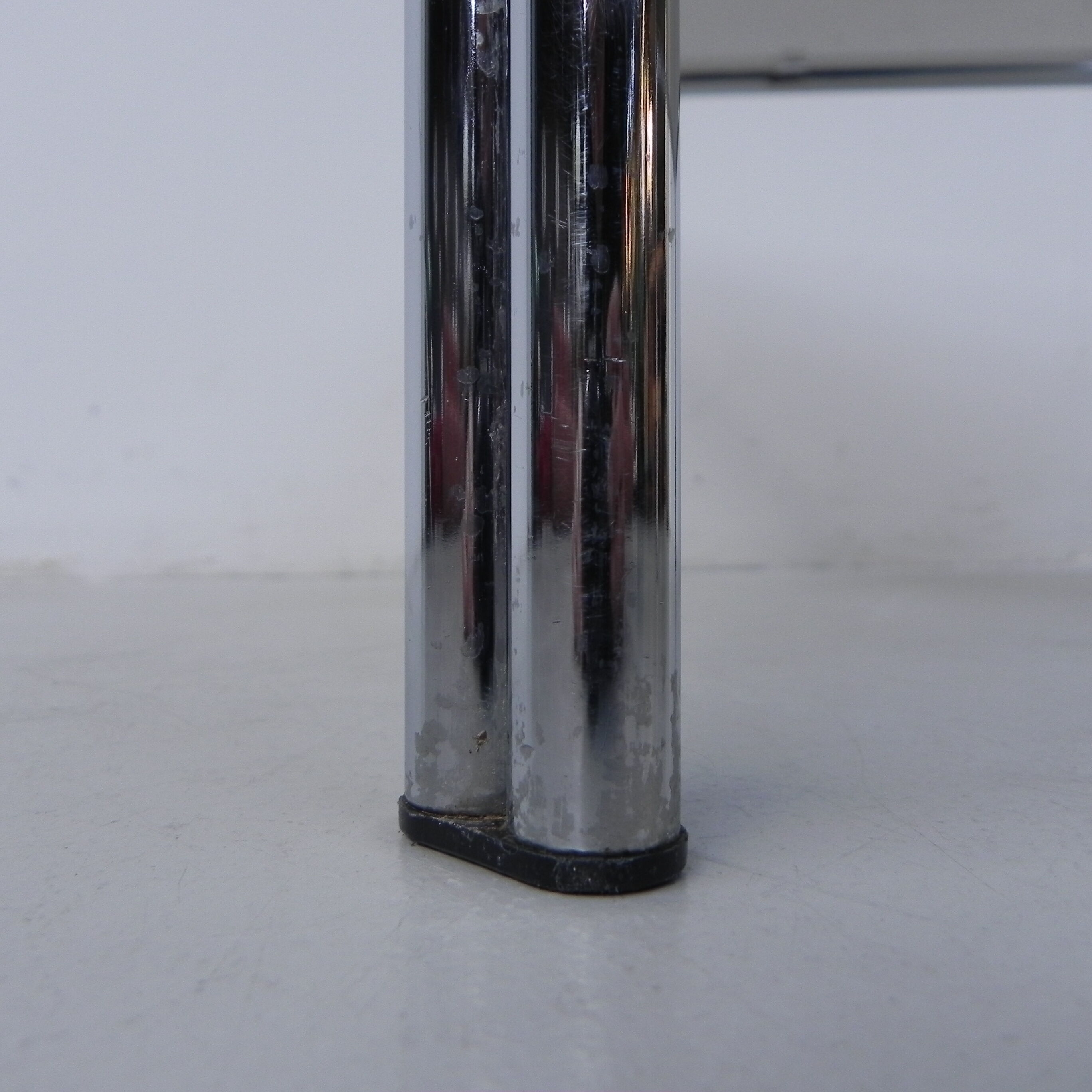 Coffee table with smoked glass top in chromed frame