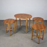 Restored Danish folding teak table with three nesting chairs by Poul Hundevad