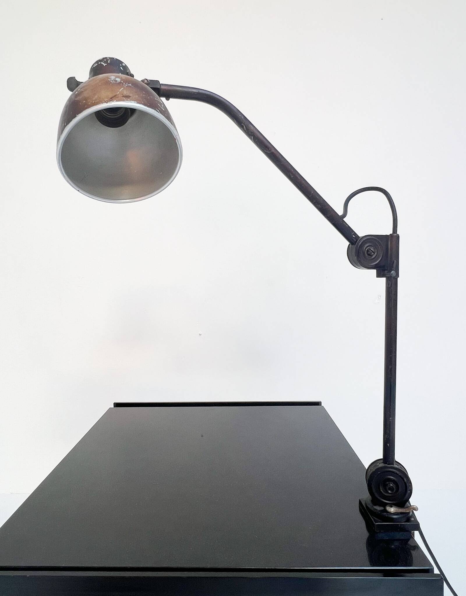 Industrial in height to be adjusted vintage clamp lamp from the 1970s