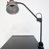 Industrial in height to be adjusted vintage clamp lamp from the 1970s