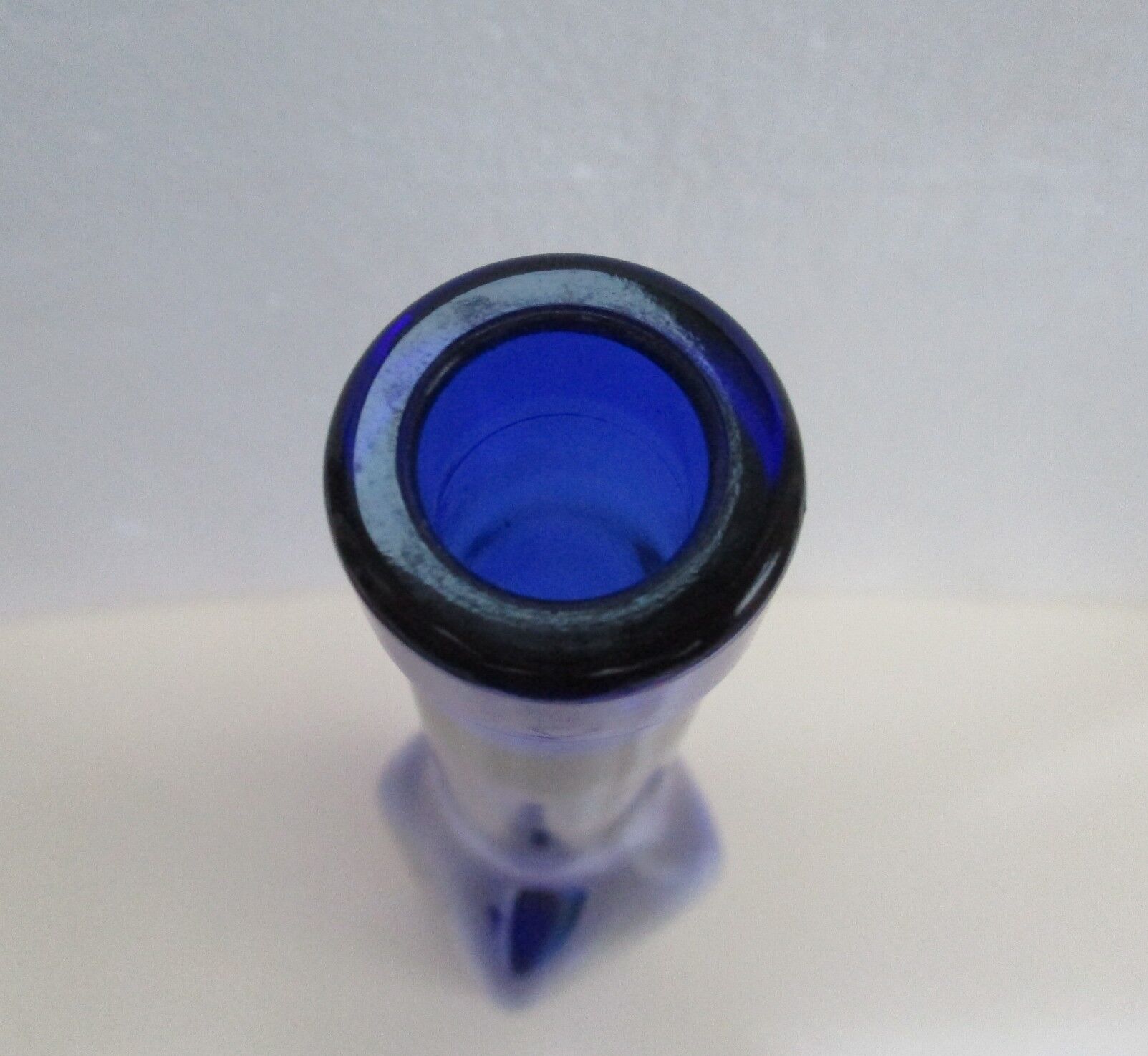 Blue glass bottle, square