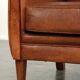 Sturdy vintage sheepskin armchair with a beautiful cognac colour