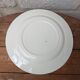 Round service plate in Iron Earth Salins model Nénuphar 29cm