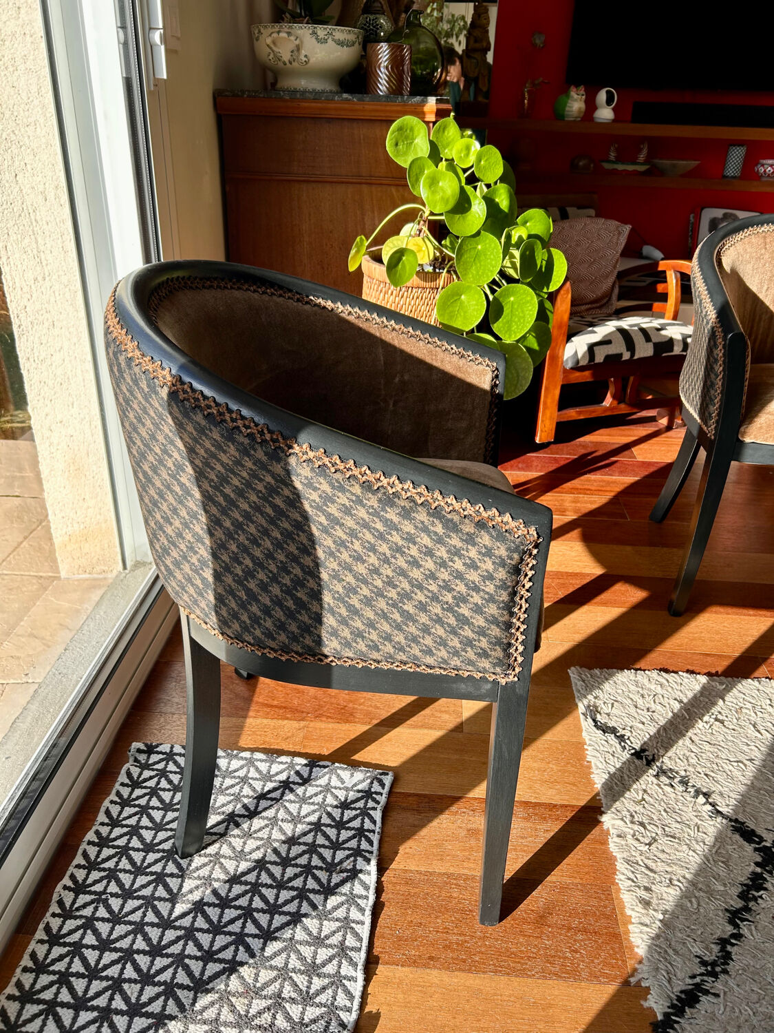 Pair of Art Deco barrel chairs in black and bronze